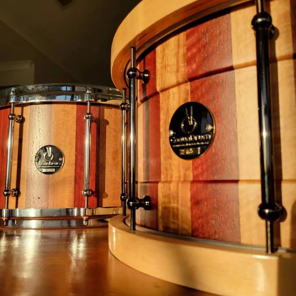 Display photo of a jarrah and blackbutt pair of snares. one baritone